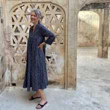 Load image into Gallery viewer, Model wearing kaftan dress with red and blue print in Amber Palace Jaipur India