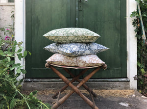 Pile of block printed pillows with floral design