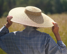 Load image into Gallery viewer, Woman seen from back wearing dove blue grey kimono with checks and large straw hat on a summer´s day