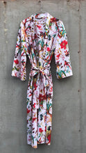 Load image into Gallery viewer, Floral patterned white robe hanging on a textured wall