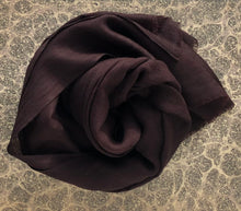 Load image into Gallery viewer, rolled-up dark brown wool scarf on grey marble paper background