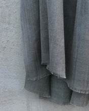 Load image into Gallery viewer, close up of grey wool scarf on a concrete wall background