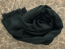 Load image into Gallery viewer, rolled-up dark green wool scarf on grey marble paper background