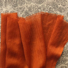 Load image into Gallery viewer, orange wool scarf on grey marble paper background