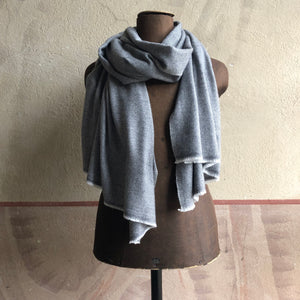 Grey herringbone scarf on brown antique mannequin doll