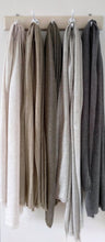 Load image into Gallery viewer, Five soft wool scarves in natural shades hanging from hook board