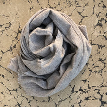 Load image into Gallery viewer, Soft stone beige wool scarf rolled on marbled beige paper